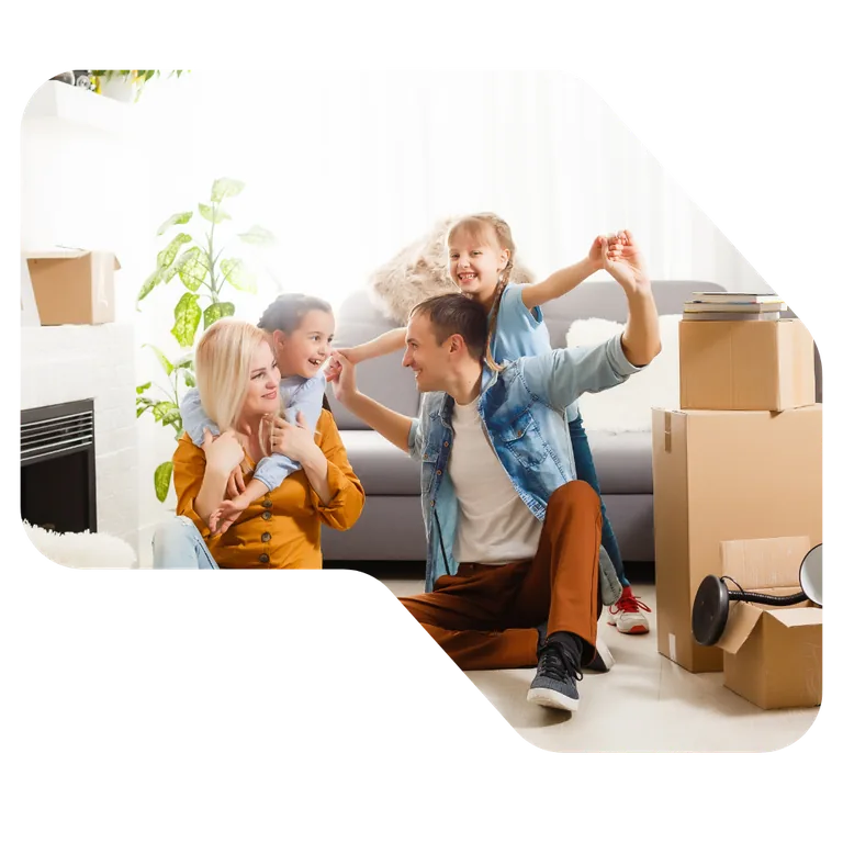 A family surrounded by moving boxes in their new home